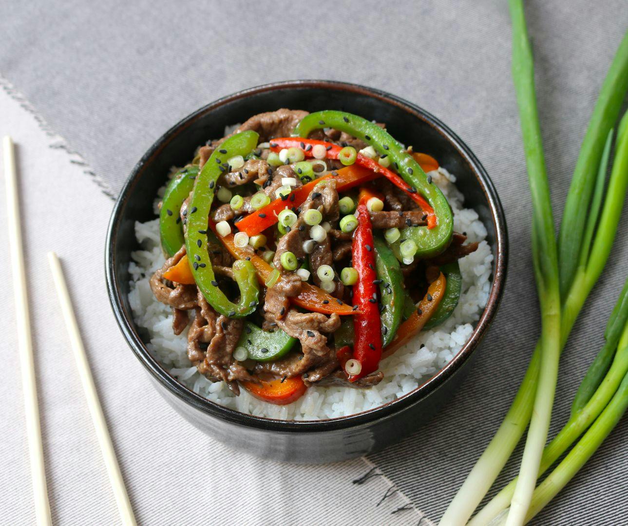 Chinese beef and capsicum stir fry on rice